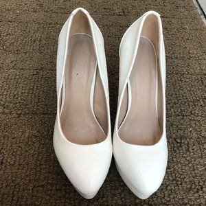 White platform pumps